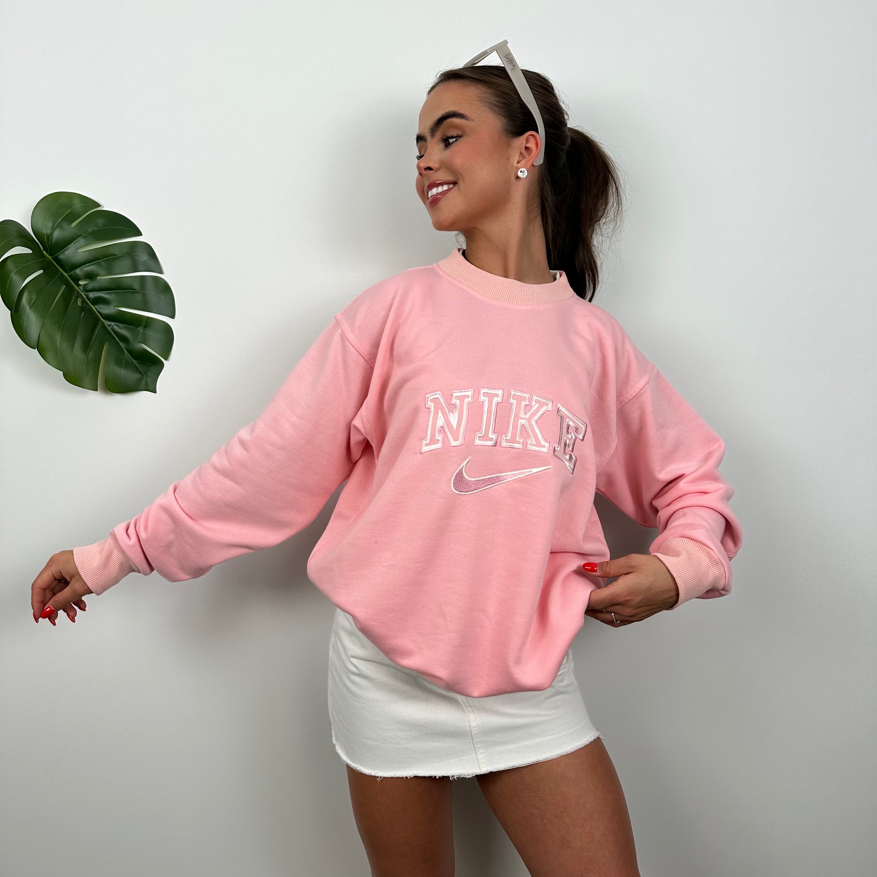 Nike Bubblegum Pink Embroidered Spell Out Sweatshirt as worn by Annalivia Hynds (L)