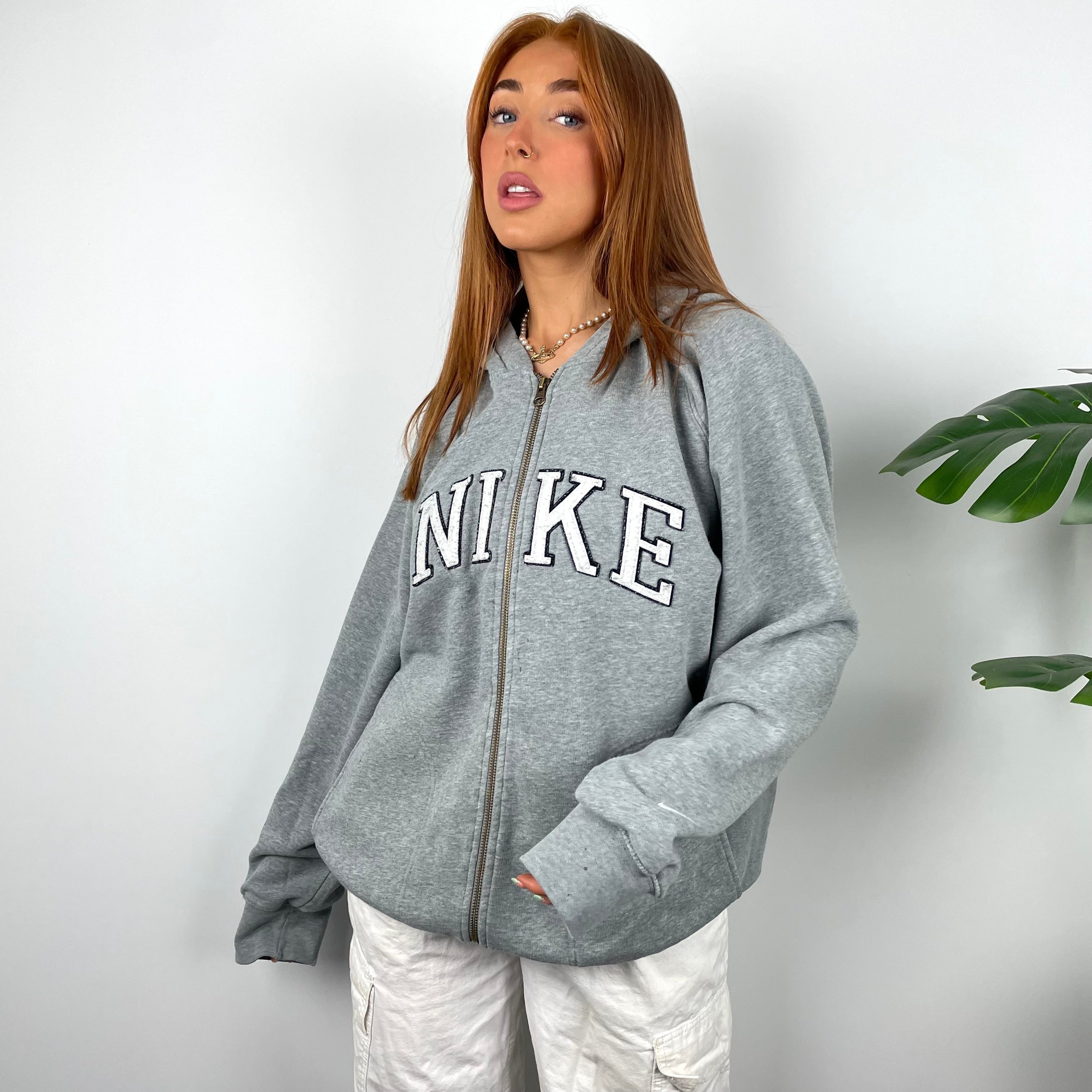 Nike Grey Embroidered Spell Out Zip Up Hoodie Jacket as worn by Annalivia Hynds (L)