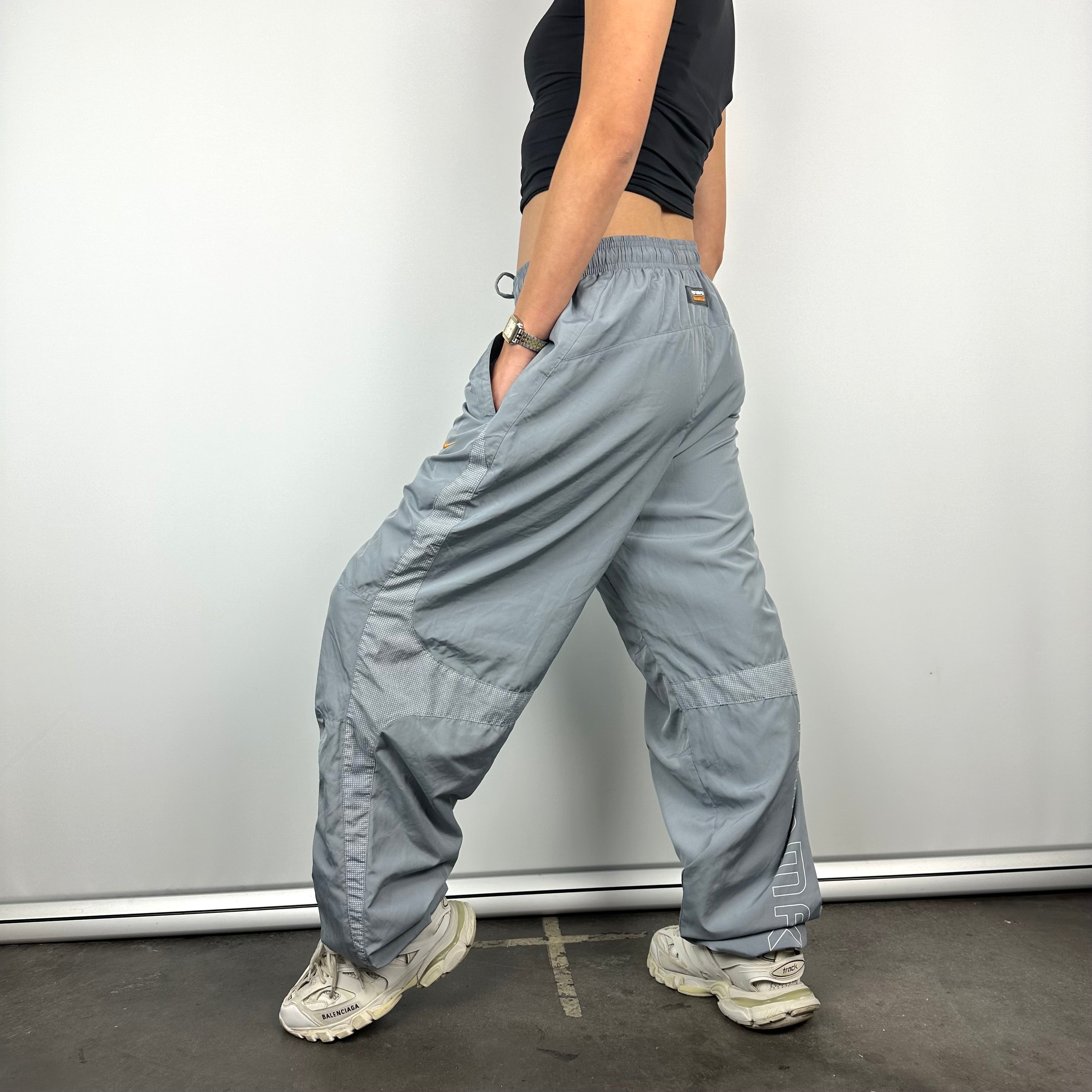 Nike air logo track best sale pants grey